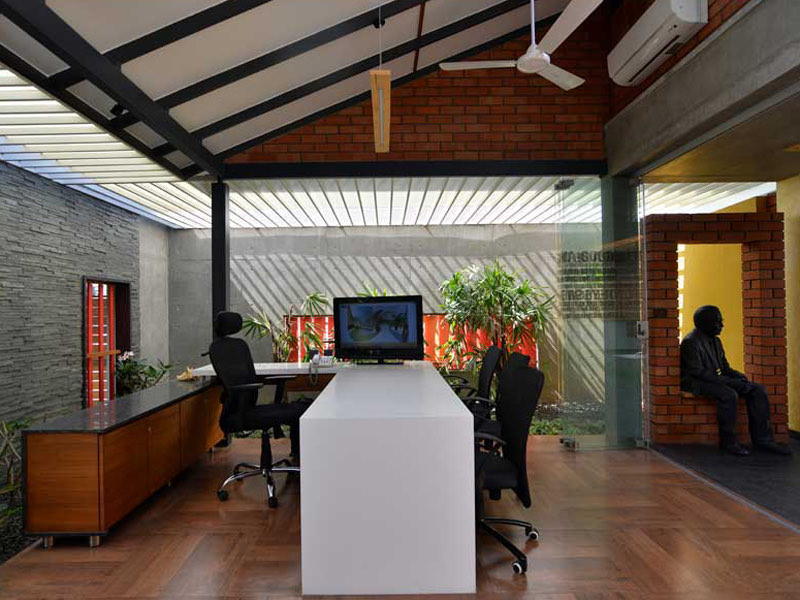 The AA&E studio &mdash; the reception desk beside the glazed court