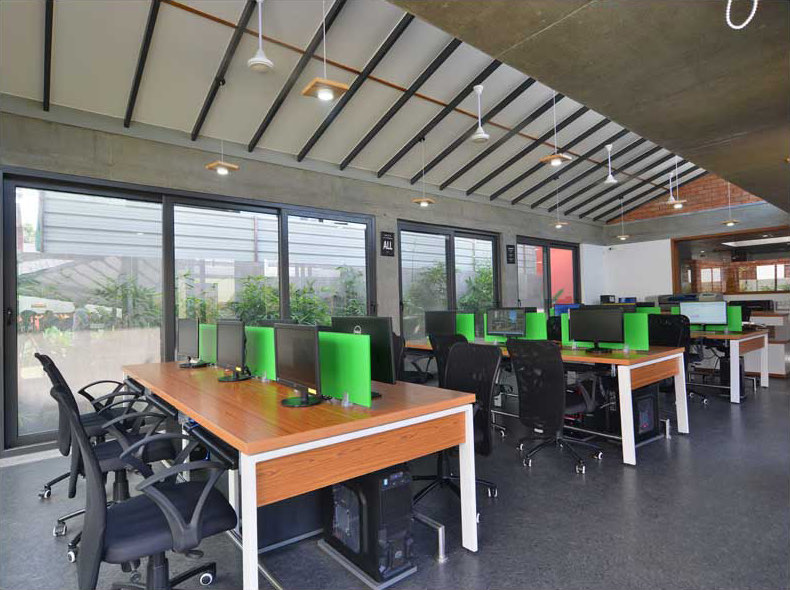 The AA&E studio &mdash; the long work tables under the roof lights